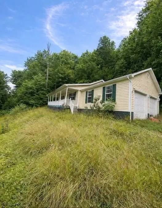 $15,000 3-Bedroom, 2-Bath Home Surrounded by Nature: An Affordable Opportunity with Endless Potential