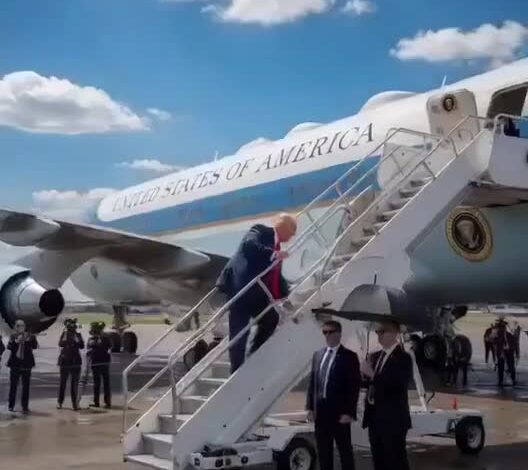 Donald Trump falls on the stairs while boarding Air Force One